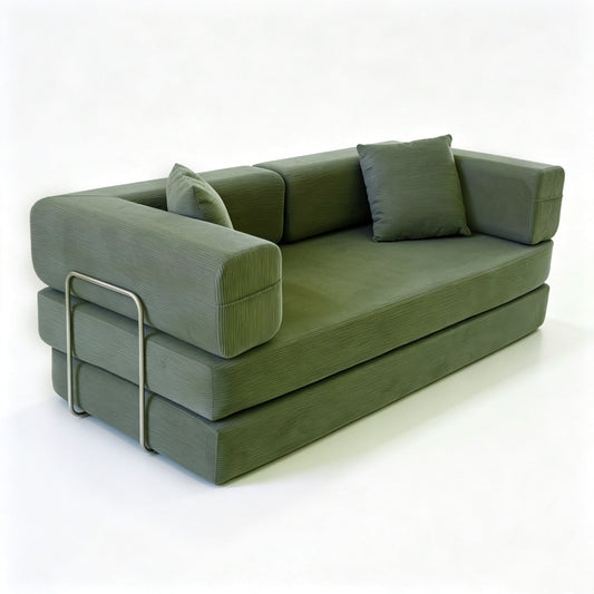 Green corduroy boneless sofa bed at 45 degrees, metal armrest support bar visible — Green
