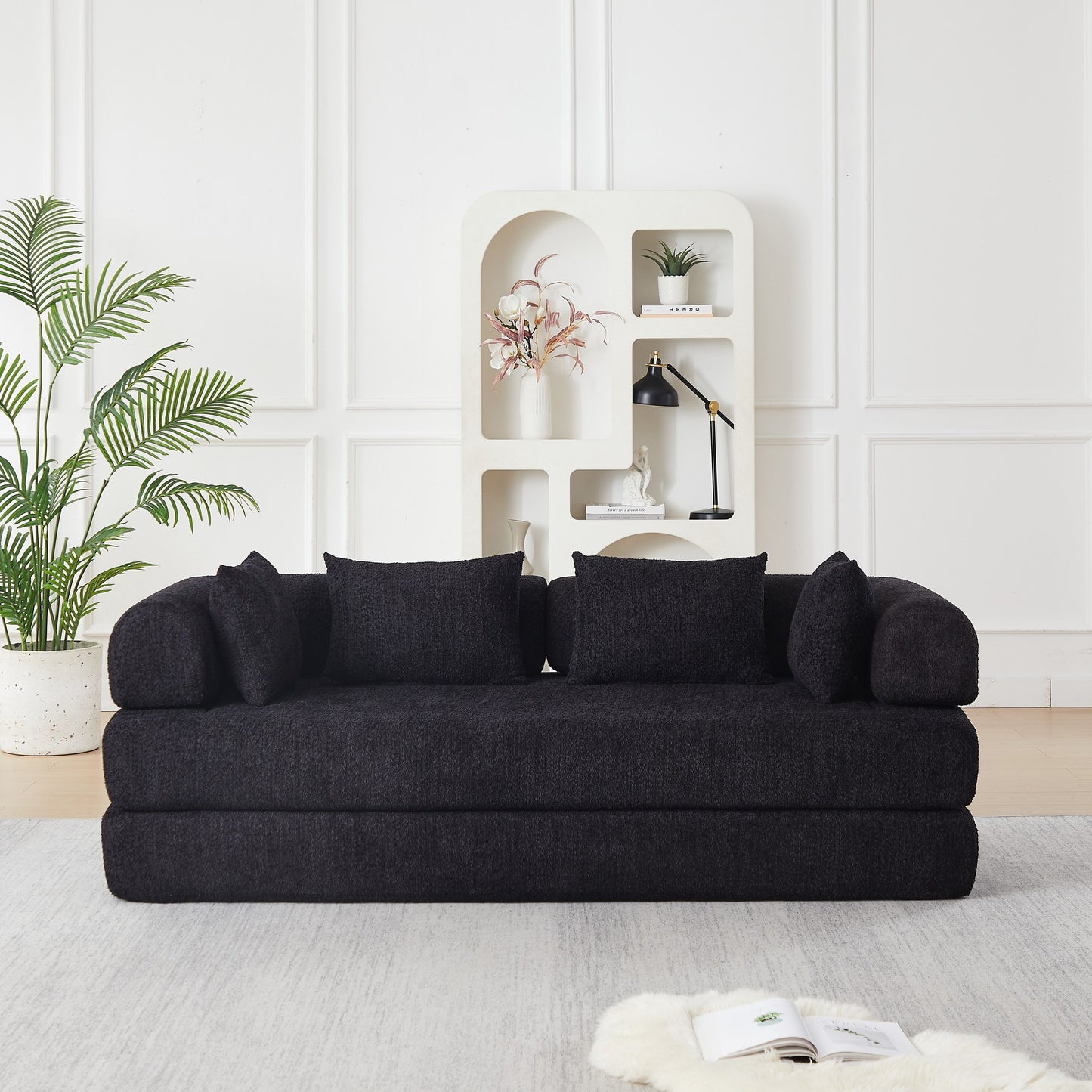 Black chenille compression sofa bed seen at a 45-degree angle, sofa mode — Black