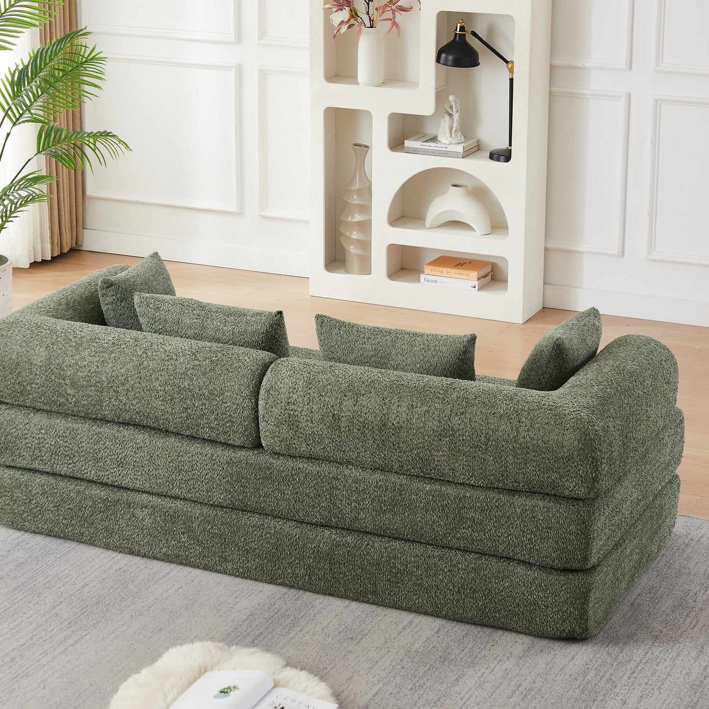 Green chenille compression sofa bed seen at a 45-degree angle, sofa mode — Green
