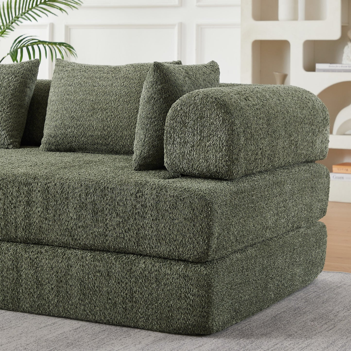Close-up of the folded foam layers and green chenille upholstery — Green
