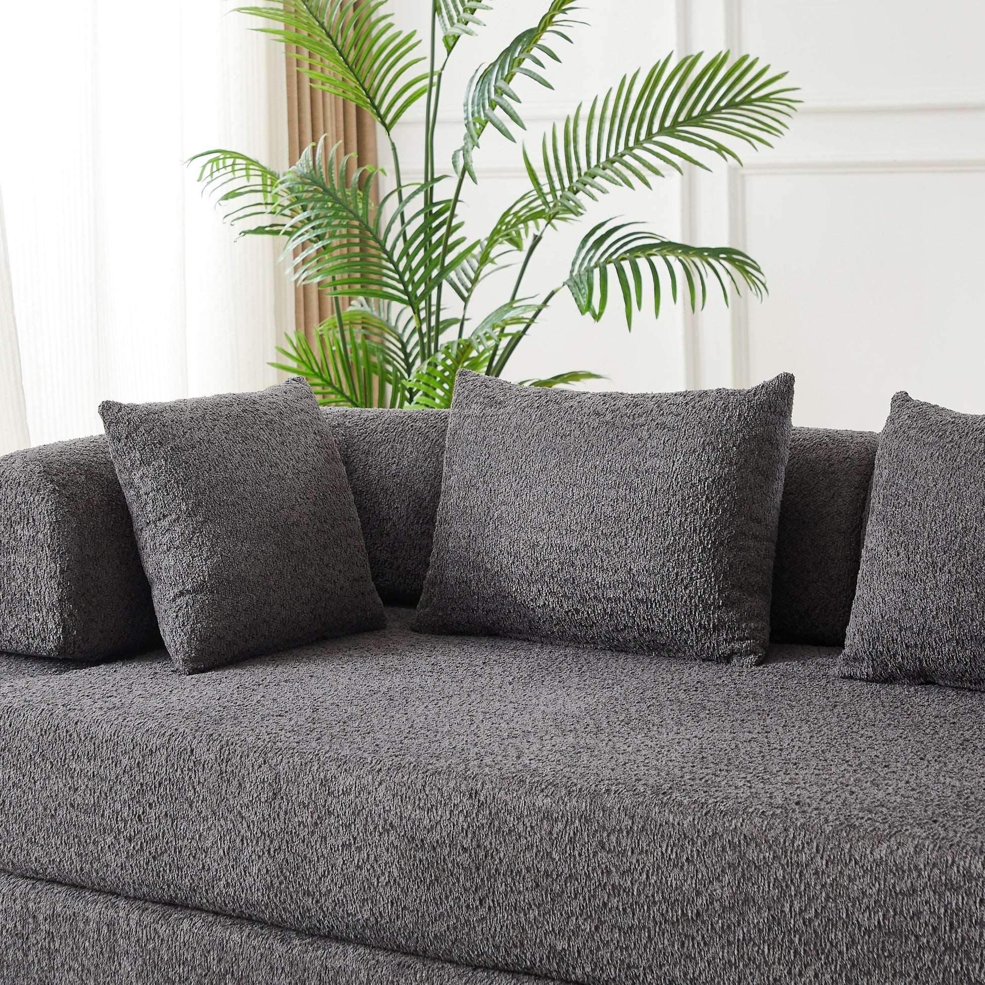 Close-up of the grey chenille fabric and the bolster back cushions — Grey