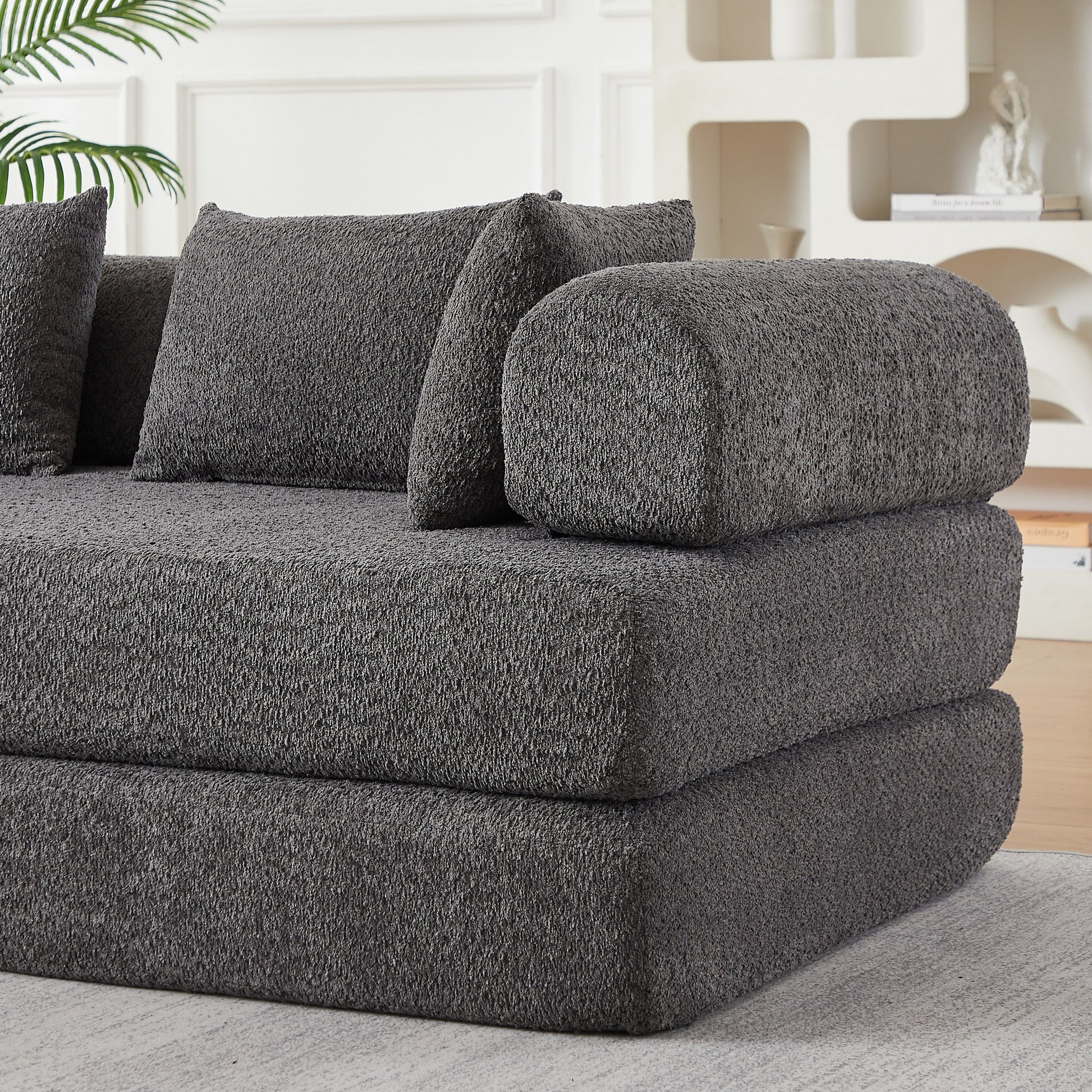 Close-up of the folded foam layers and grey chenille upholstery — Grey