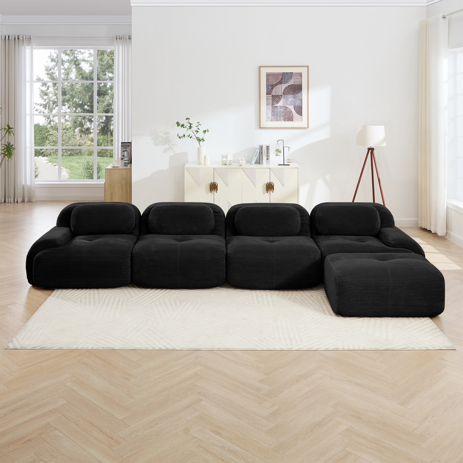Black corduroy boneless sectional, 4-seat with one ottoman layout, straight on view in a living room — Black / 4-Seat + 1 Ottoman