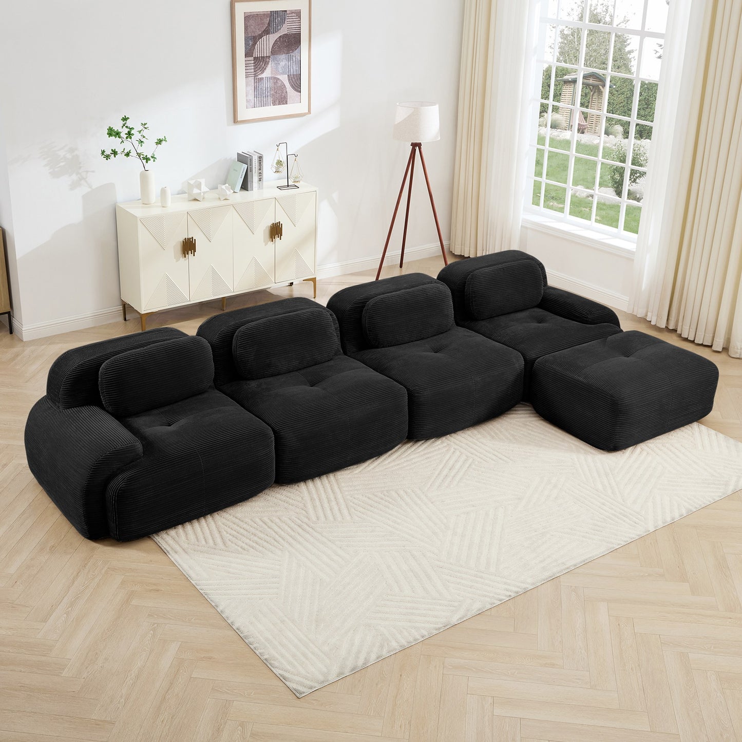 Black corduroy boneless sectional, 4-seat with one ottoman layout, angled view in a bright living room — Black / 4-Seat + 1 Ottoman
