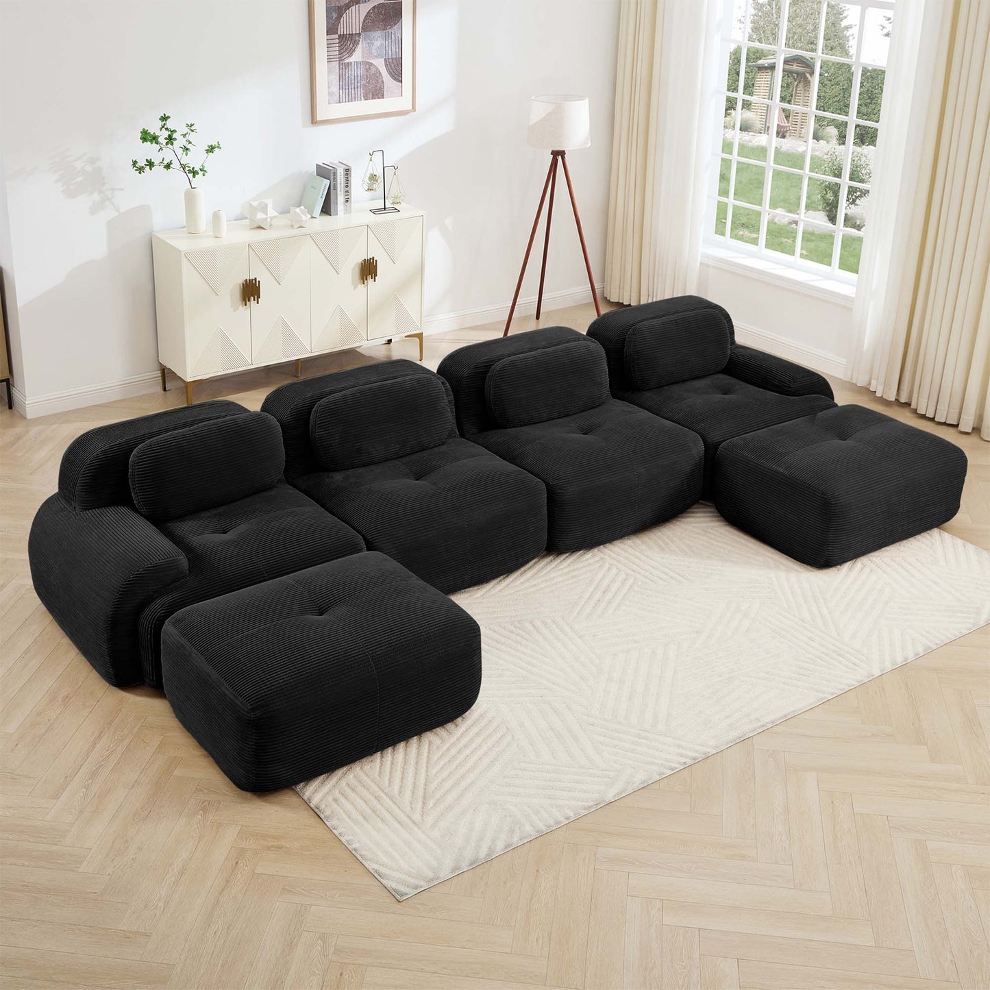 Black corduroy boneless sectional, 4-seat with two ottomans layout, angled view in a bright living room — Black / 4-Seat + 2 Ottomans