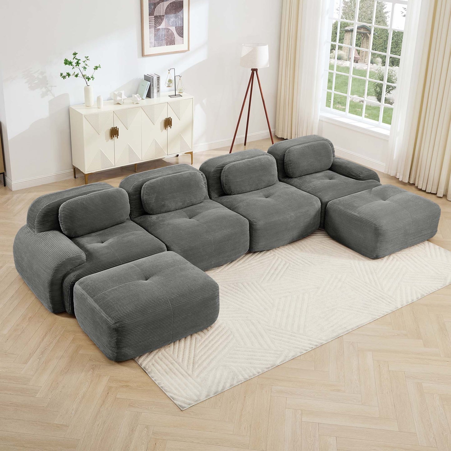 Grey corduroy boneless sectional, 4-seat with two ottomans layout, angled view in a bright living room — Grey / 4-Seat + 2 Ottomans