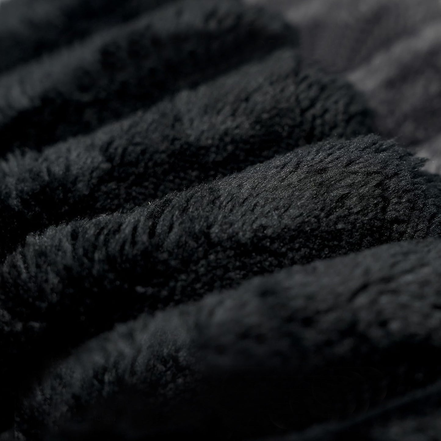 Close-up of the wide-wale black corduroy fabric and channel stitching — Black / 2-Seat (63"W)