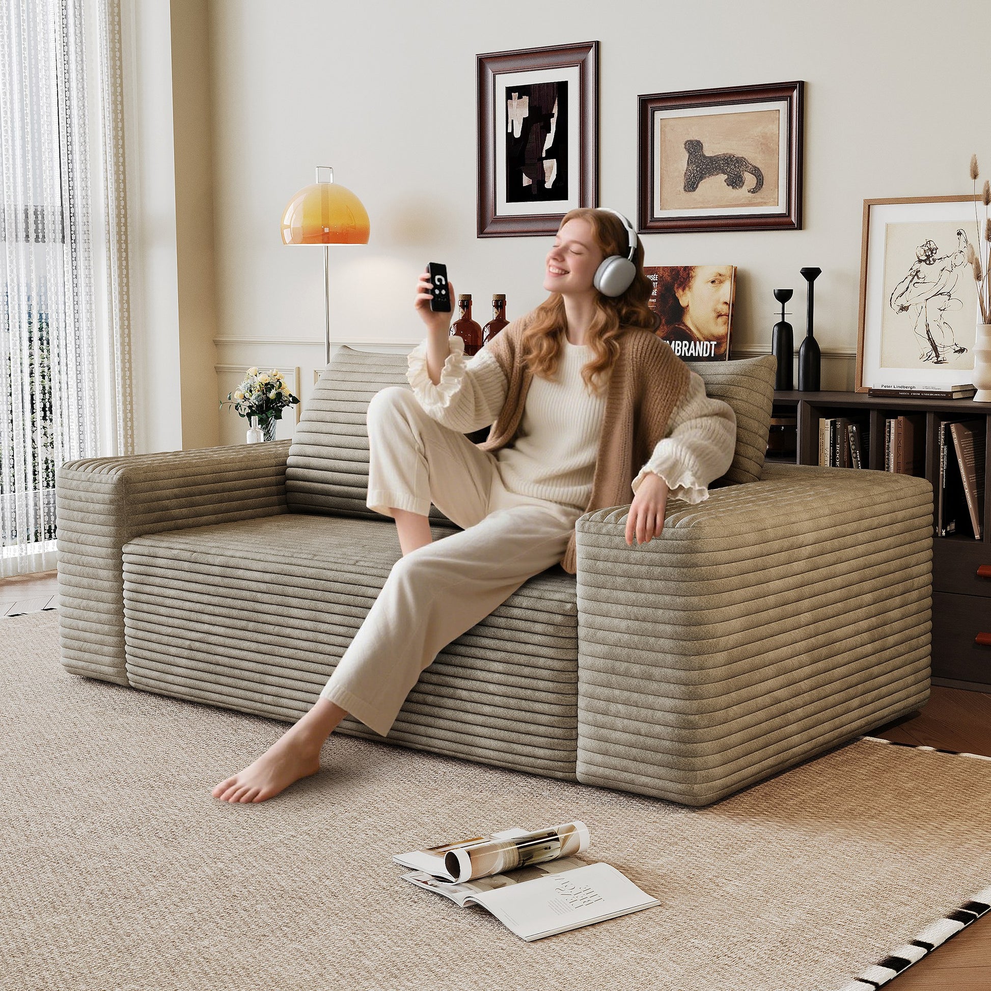 Woman relaxing on the camel corduroy boneless sofa, 2-seat 63-inch, showing seat depth — Camel / 2-Seat (63"W)
