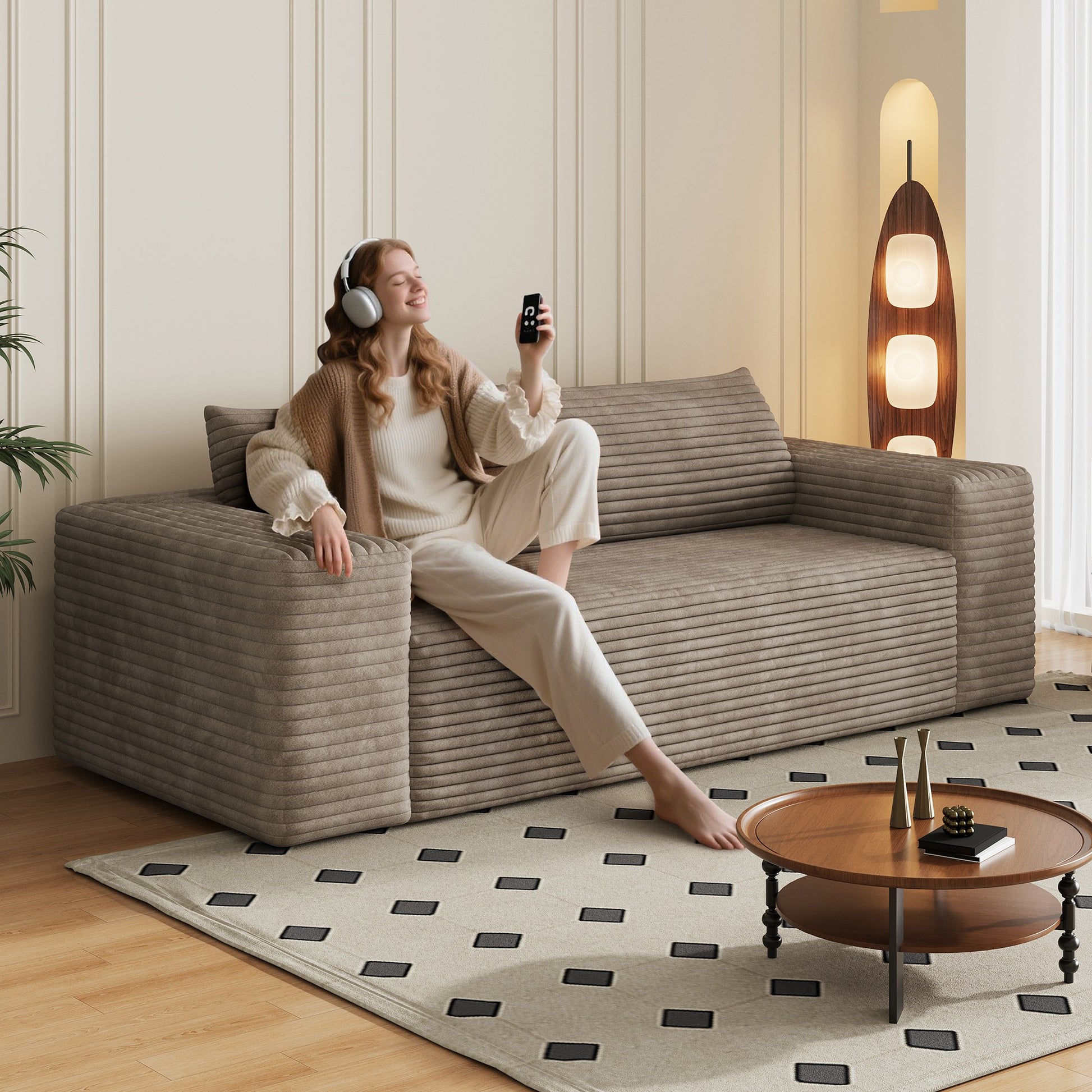 Woman relaxing on the camel corduroy boneless sofa, 3-seat 78.8-inch, showing seat depth — Camel / 3-Seat