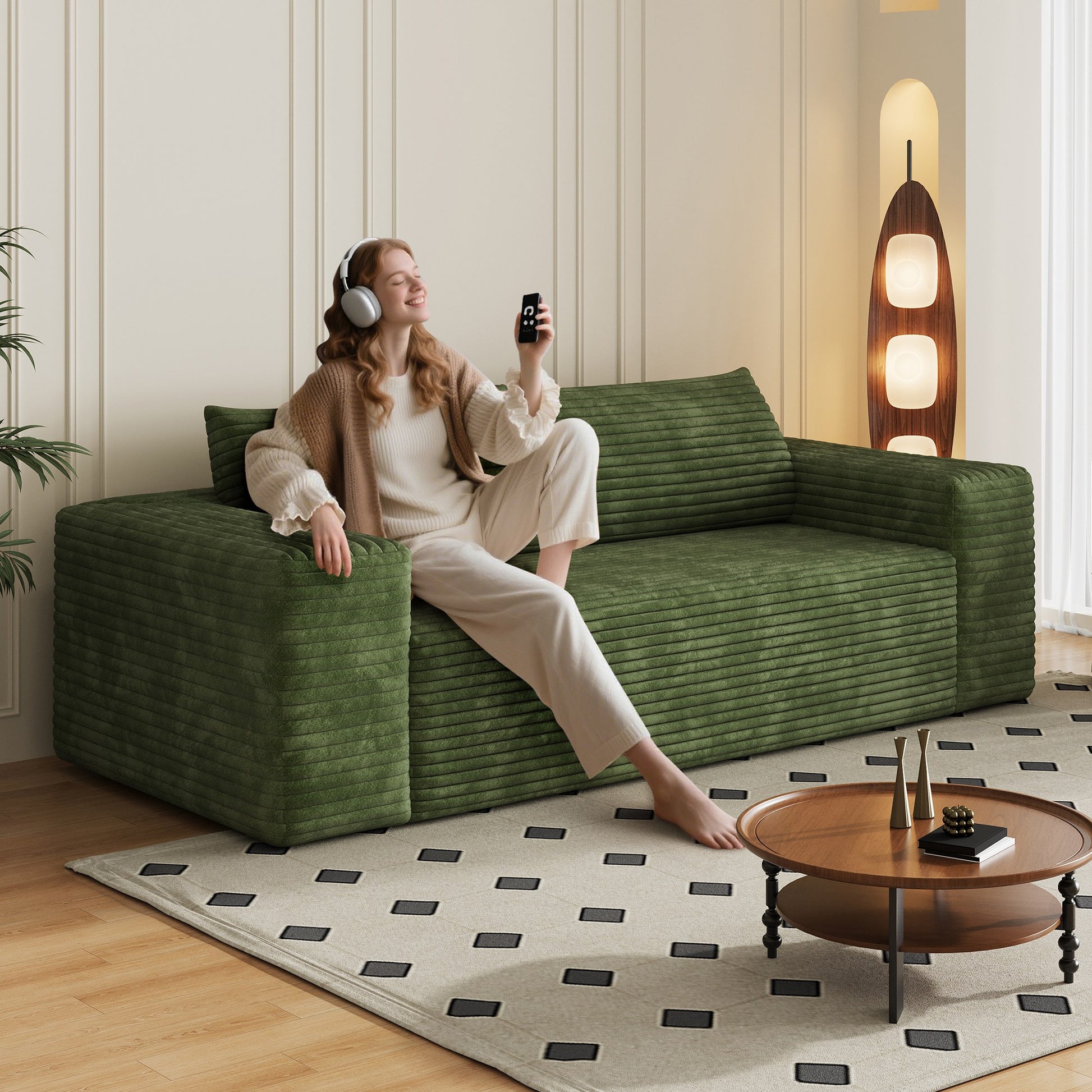 Woman relaxing on the green corduroy boneless sofa, 3-seat 78.8-inch, showing seat depth — Green / 3-Seat