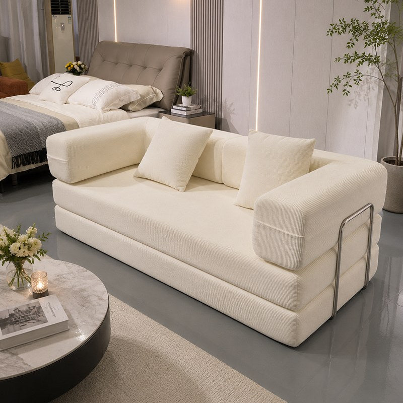 Ancient White corduroy boneless sofa bed at the foot of a bed in a sunlit bedroom — Ancient White