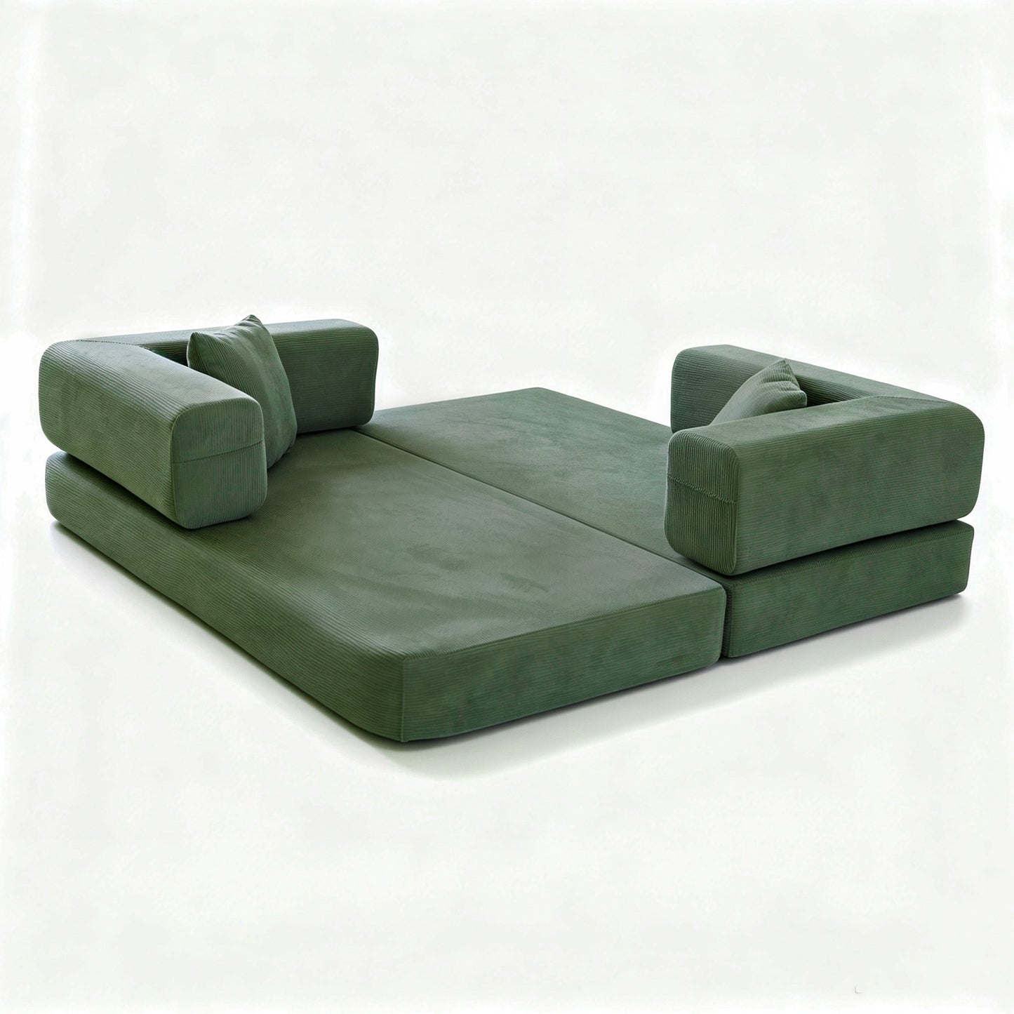 Green corduroy boneless sofa bed laid completely flat, showing the foam mattress and loose bolsters — Green