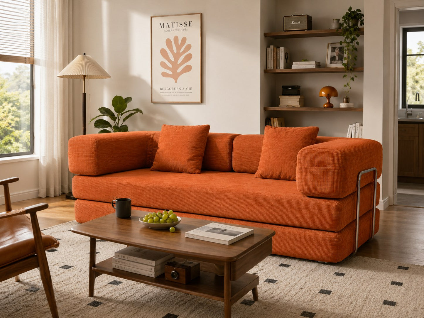 Orange corduroy boneless sofa bed beside a wooden coffee table in a bright room — Orange