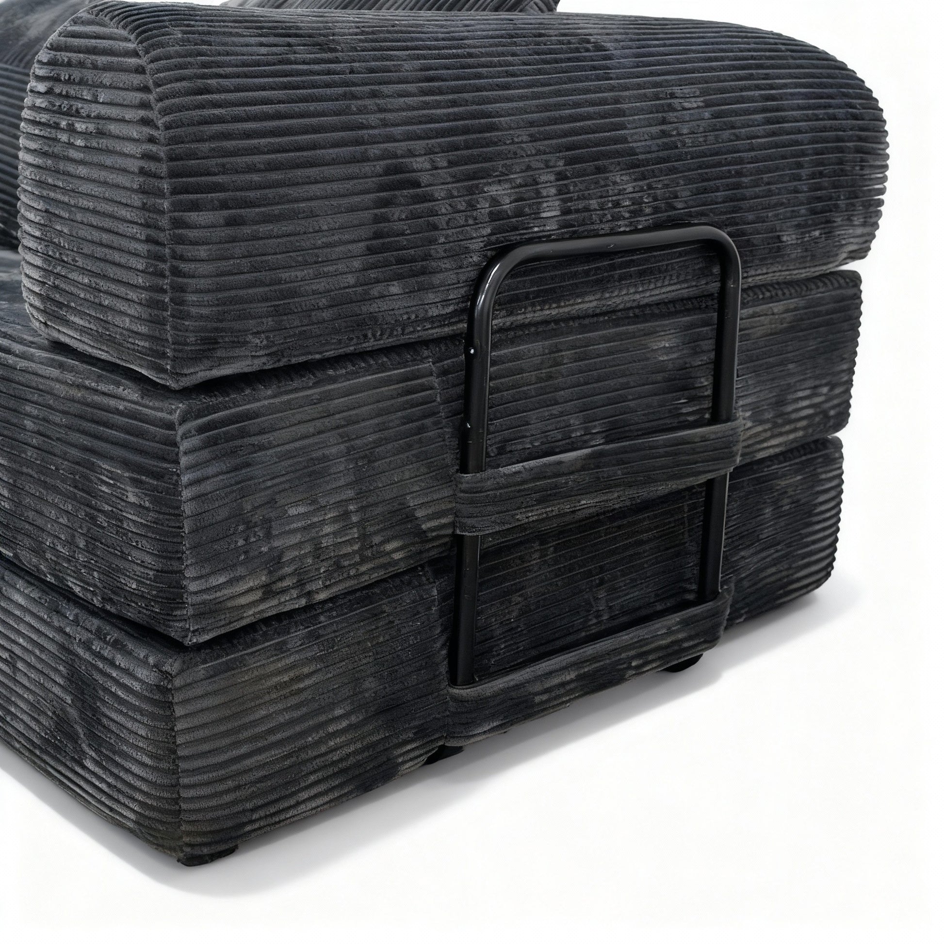 Close-up of the folded corduroy foam layers and the metal support bar in the armrest — Antique Grey