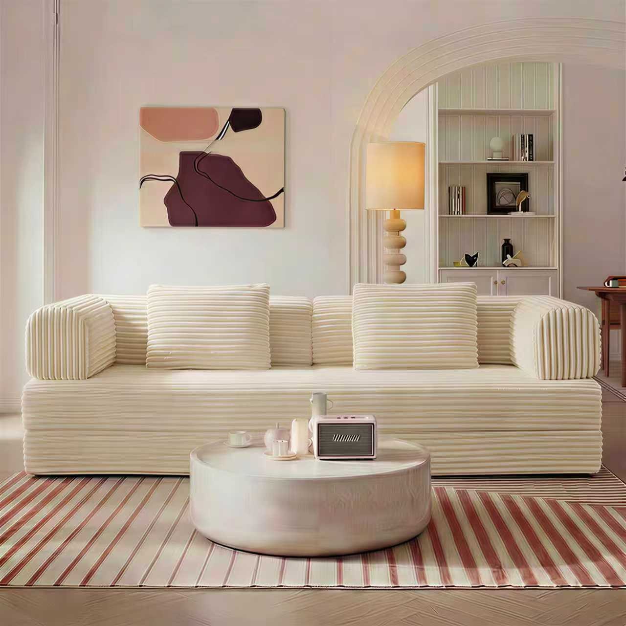 Beige corduroy boneless sofa bed in sofa mode in a living room — Beige