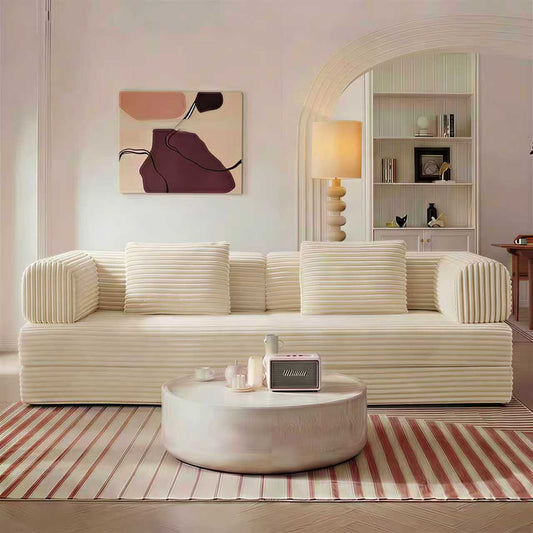 Beige corduroy boneless sofa bed in sofa mode in a living room — Beige