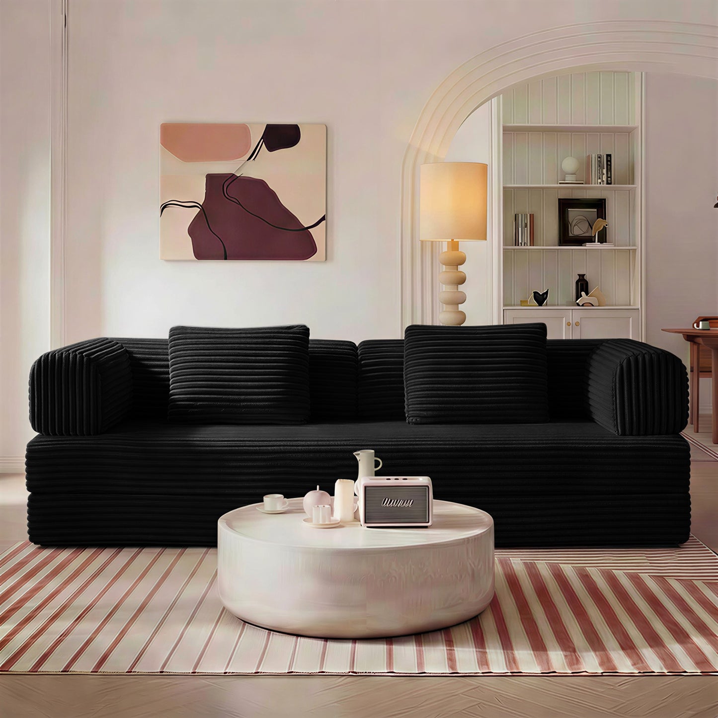 Black corduroy boneless sofa bed in sofa mode in a living room — Black