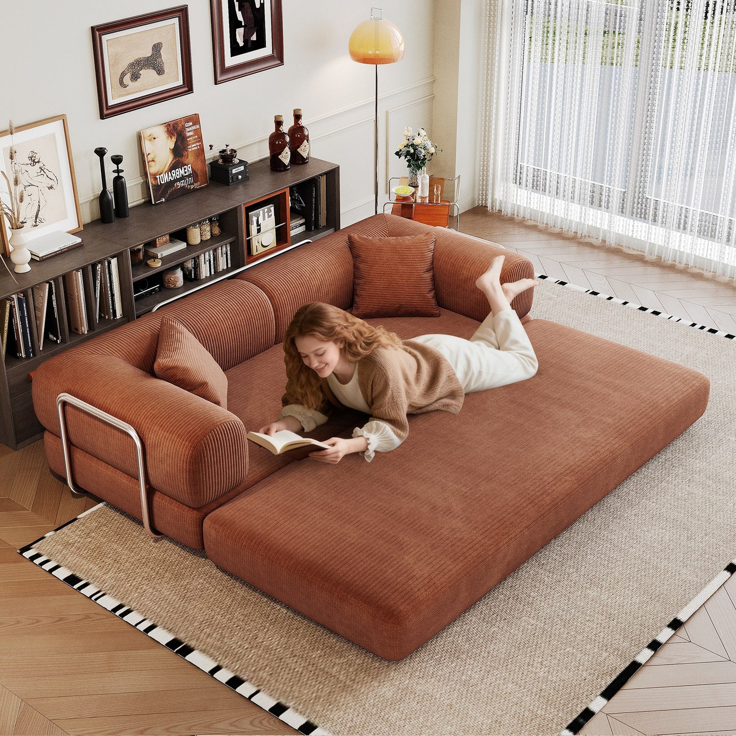 Brown corduroy boneless sofa bed unfolded flat into a bed, person lying on it — Brown