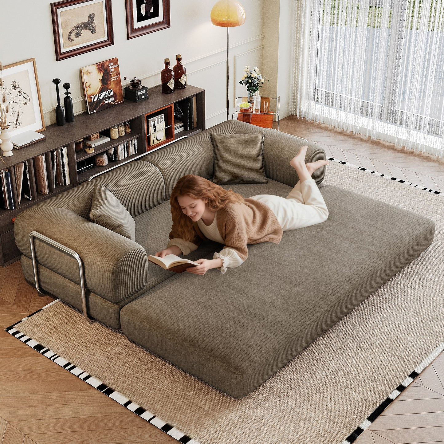 Camel corduroy boneless sofa bed unfolded flat into a bed, person lying on it — Camel