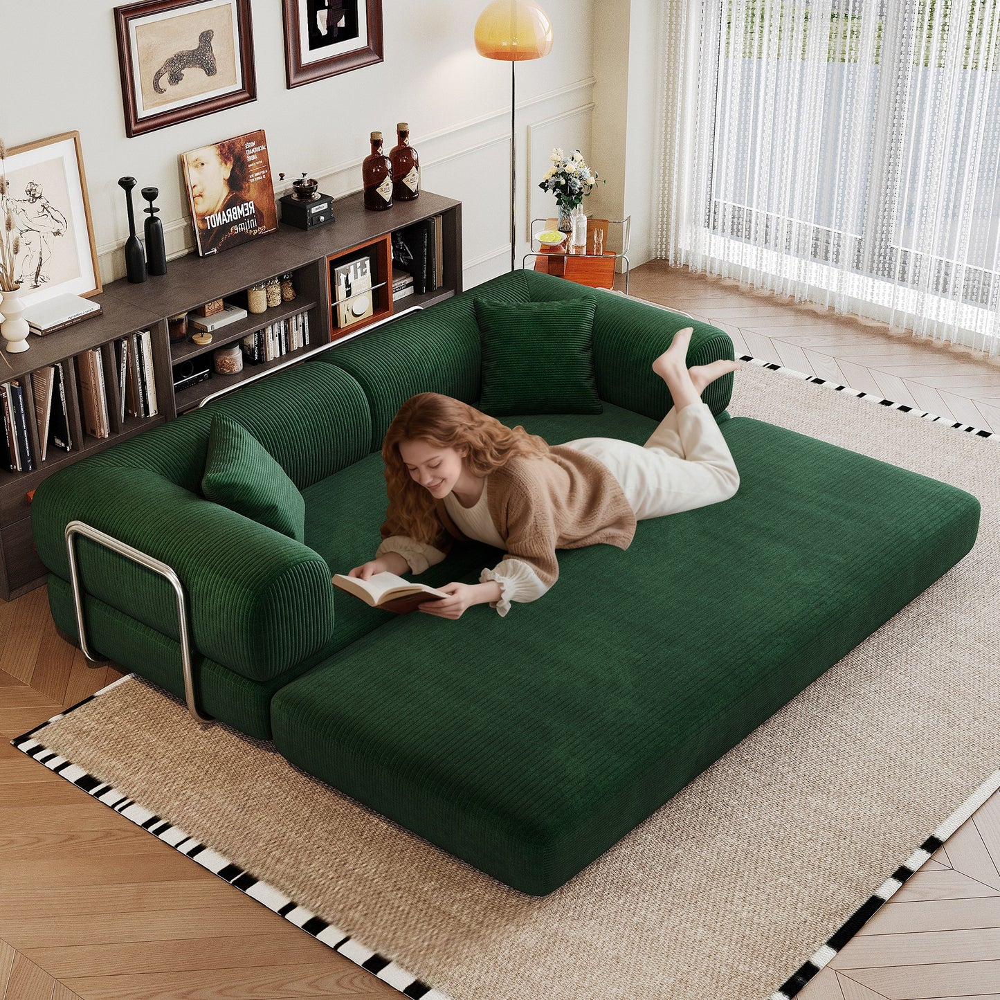 Green corduroy boneless sofa bed unfolded flat into a bed, person lying on it — Green