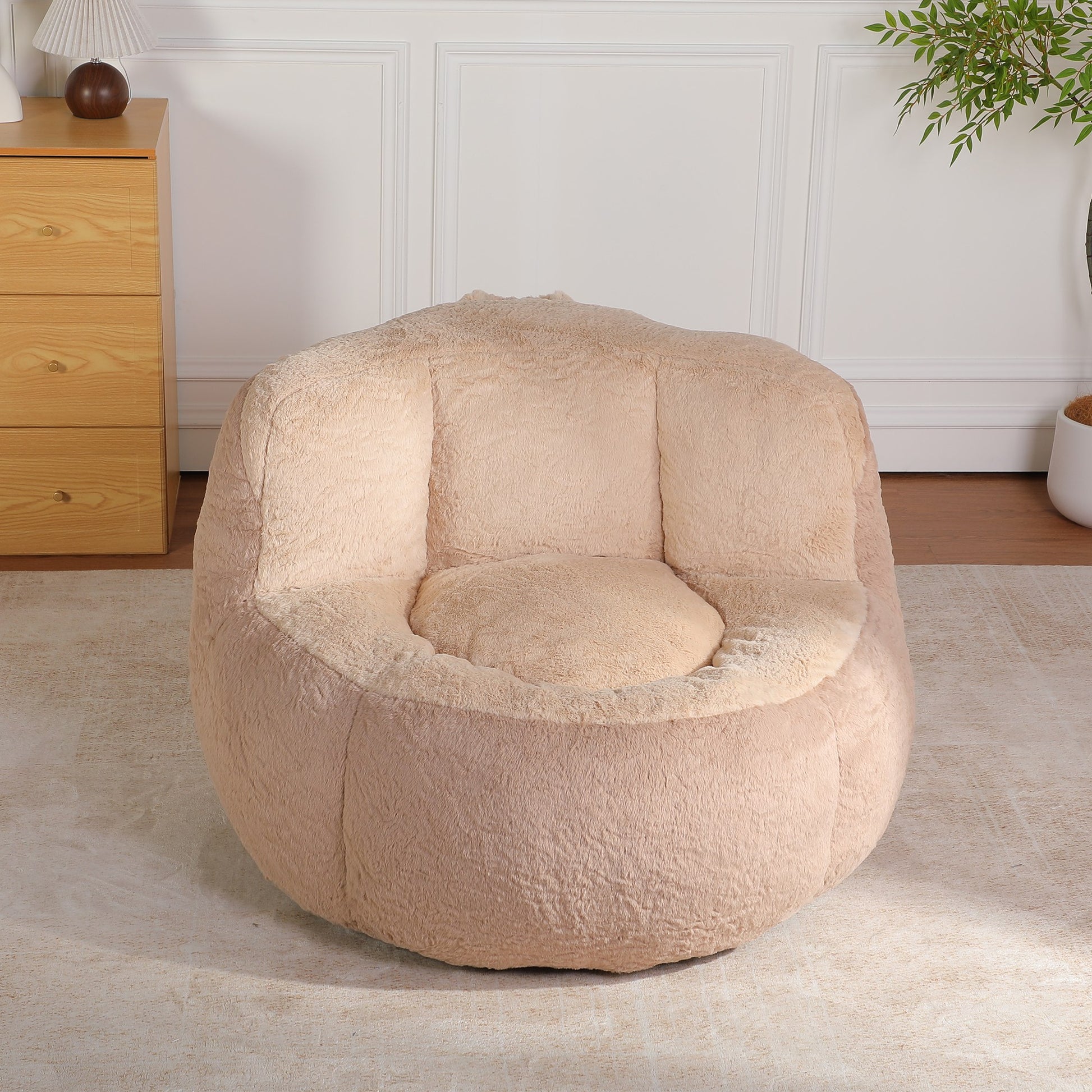 Apricot faux fur boneless accent chair (warm sand-beige) in a bedroom corner, 45-degree view — Apricot