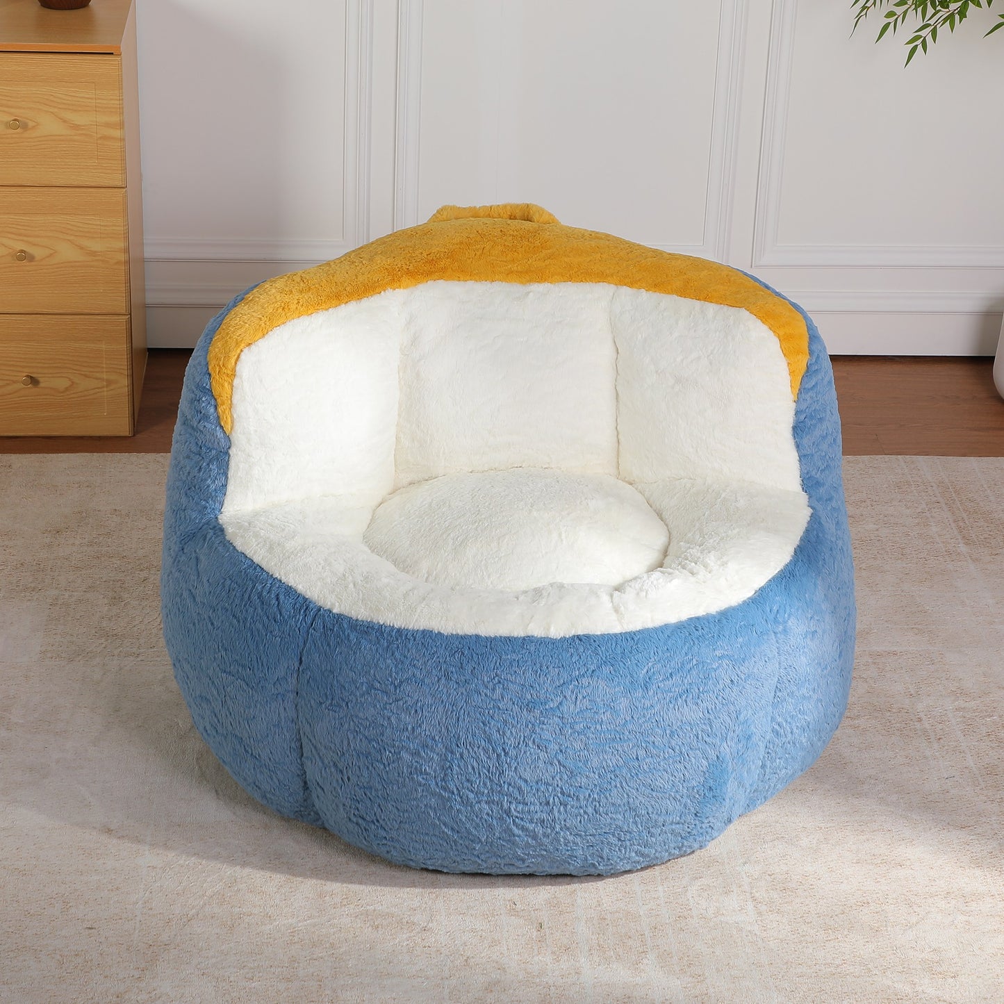 Blue faux fur boneless accent chair (blue, mustard and cream) in a bedroom corner, 45-degree view — Blue