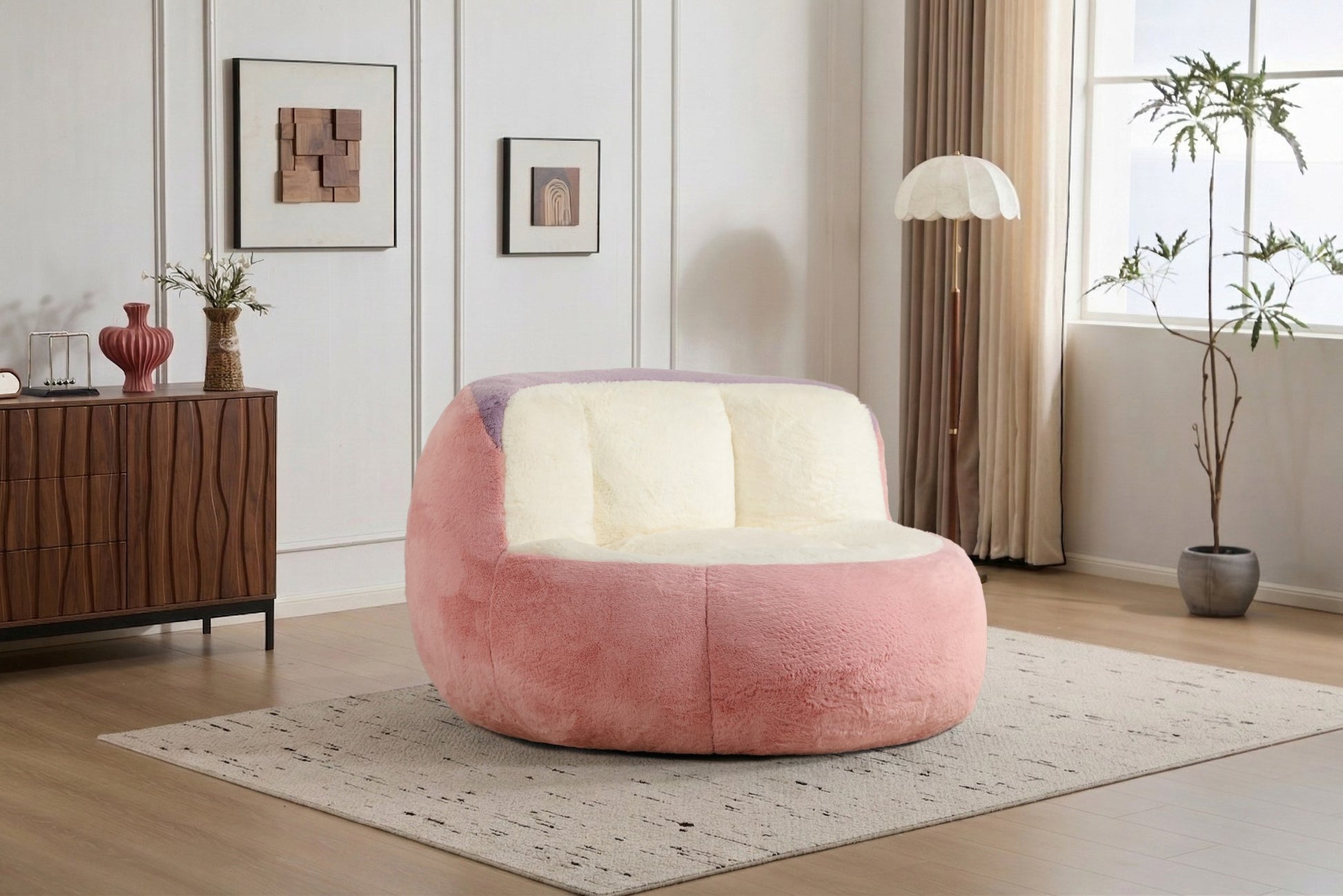 Pink faux fur boneless accent chair on a rug in a living room, showing its 43-inch footprint — Pink