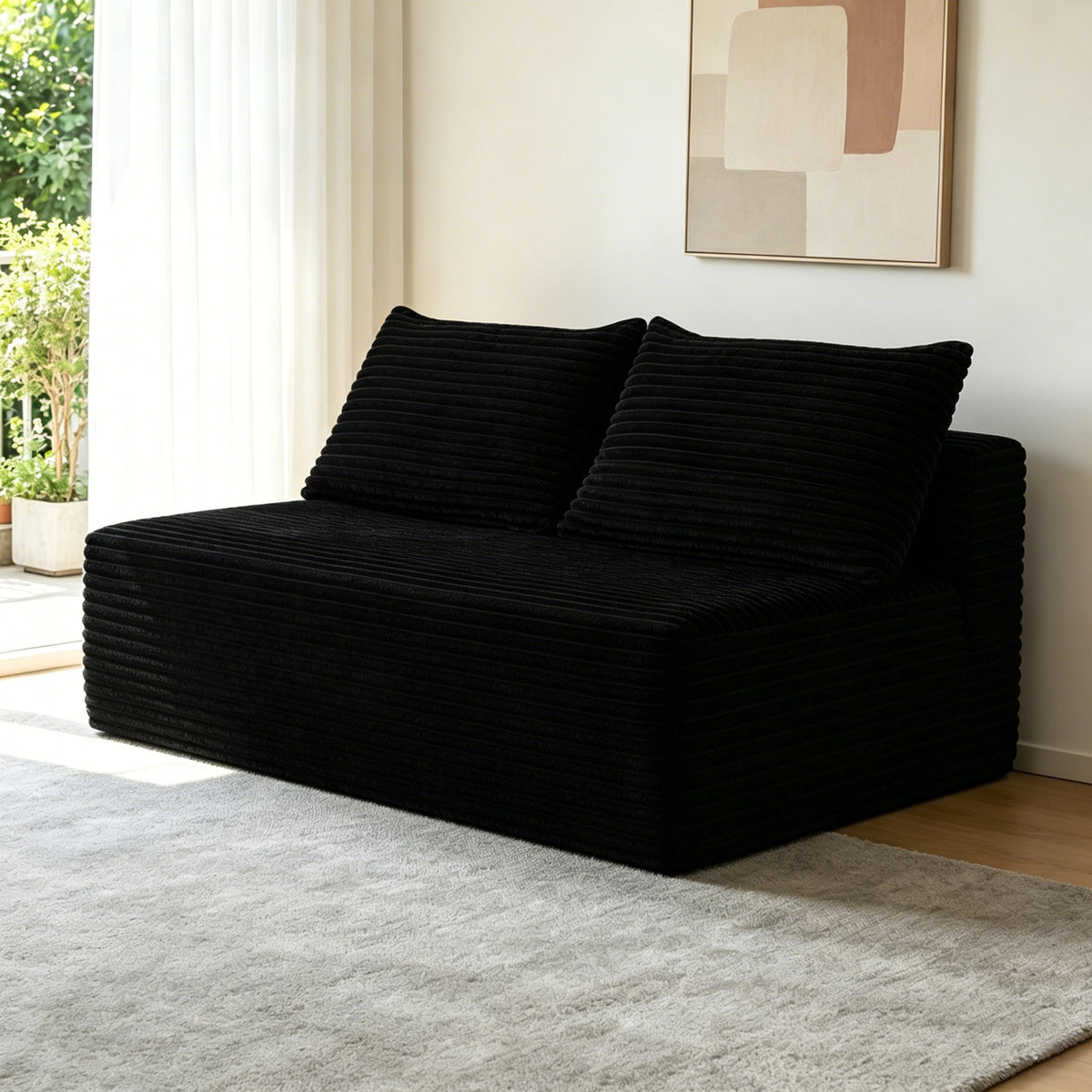 Black plush boneless loveseat in a living room — Black