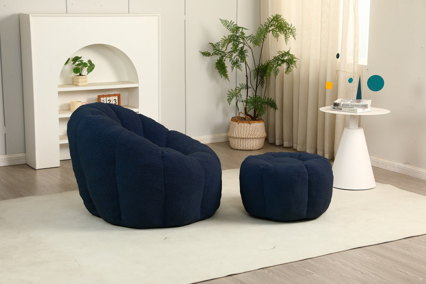 Navy teddy fleece accent chair and ottoman seen from the side on a cream rug — Dark Blue / 1-Seat + 1 Ottoman