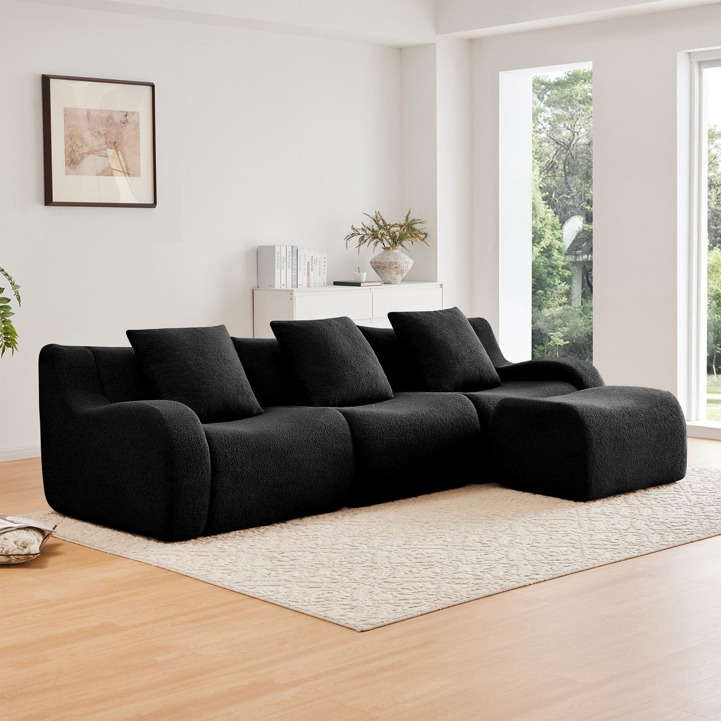 Black teddy fleece boneless sofa, 3-seat with one ottoman layout, angled view in a bright living room — Black / 3-Seat + 1 Ottoman